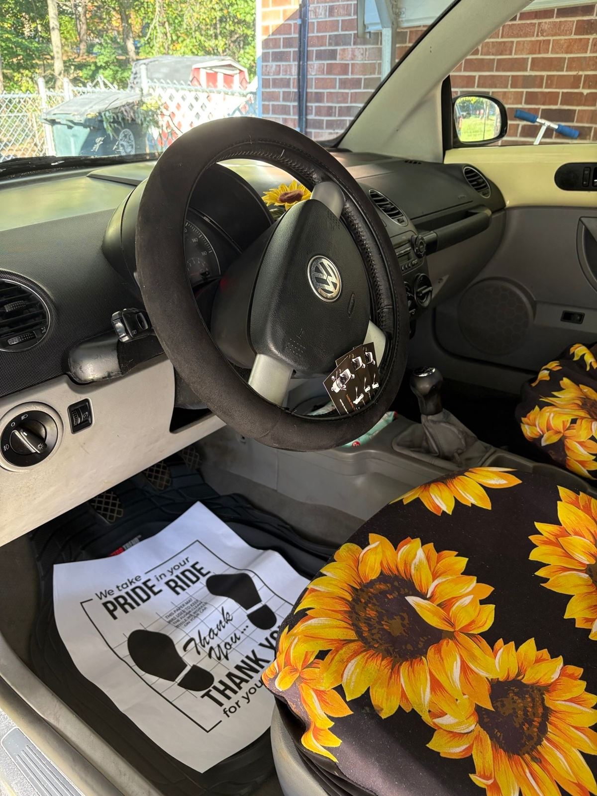Volkswagen Beetle interior after detailing, with a protective paper floor mat